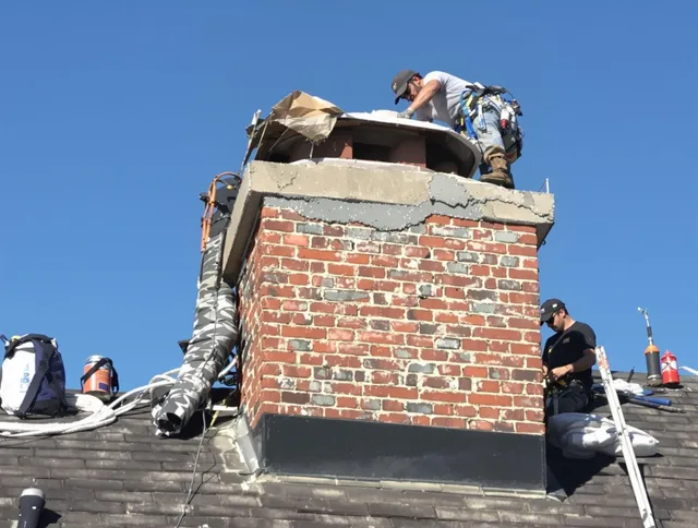Sunrise Chimney Sweep installing a custom chimney crown in Sunrise, FL