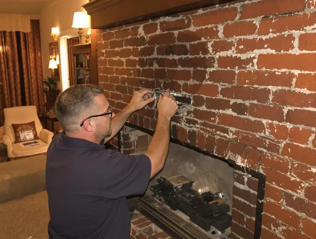 Sunrise Chimney Sweep expert fixing a fireplace in Sunrise, FL